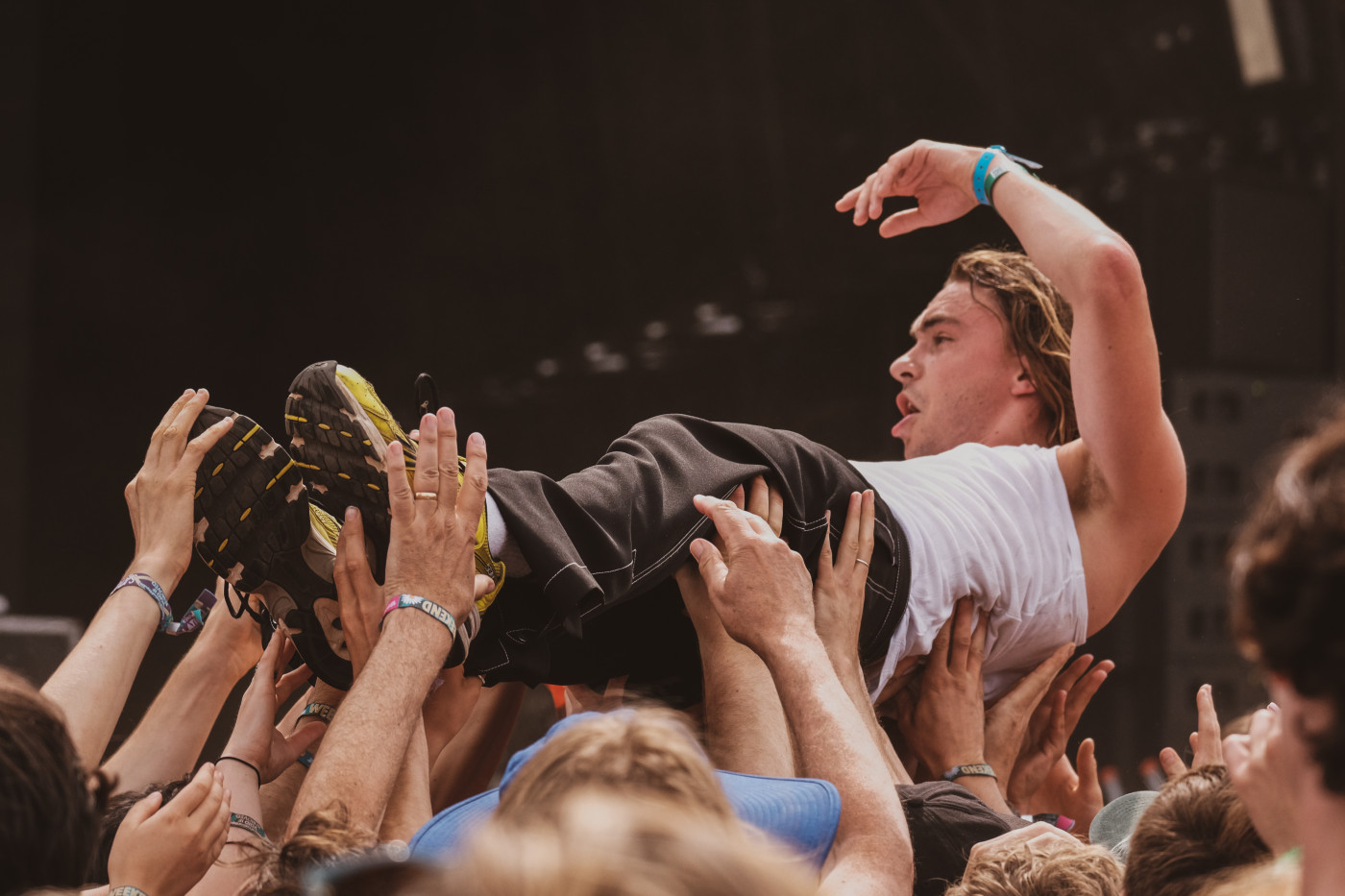Alex Rice of Sports Team crowdsurfs during his band's performance.