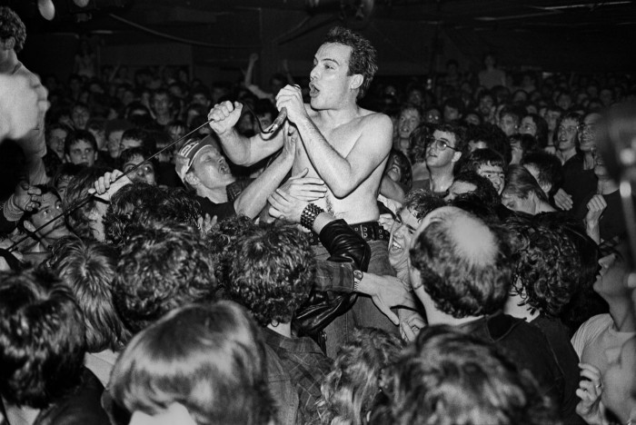 Jello Biafra of the Dead Kennedys crowded with audience, Boston, 1981